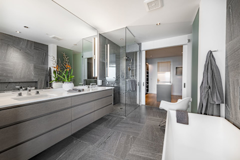 A powder room bathroom with grey style.
