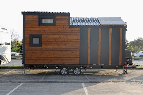 Brown tiny house on a trailer