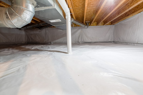 This image shows a radon mitigation system installed in an attic space.