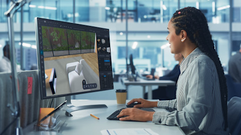 An interior designer is looking through her 3D plans.