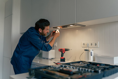 Handyman fixing electronic 
