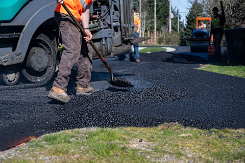 Asphalt being placed on a driveway