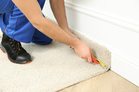 Worker replacing carpet